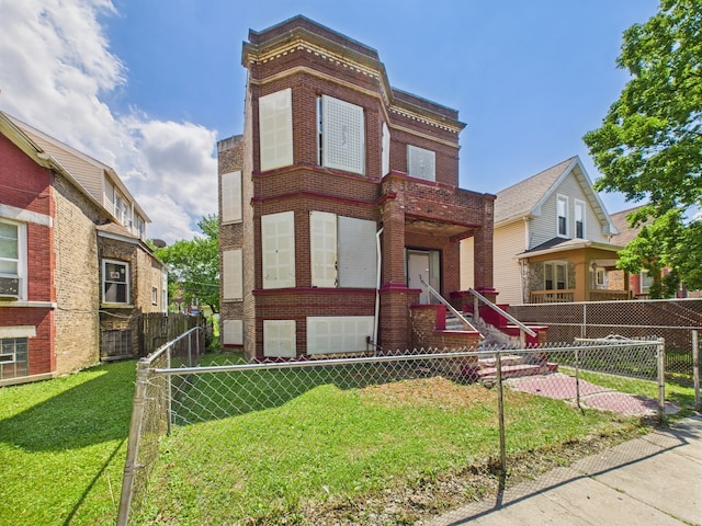 5045 W Erie St, Chicago, IL 60644 - view of front of house with brick siding and a fenced front yard