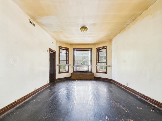 5045 W Erie St, Chicago, IL 60644 - unfurnished room featuring wood-type flooring and baseboards