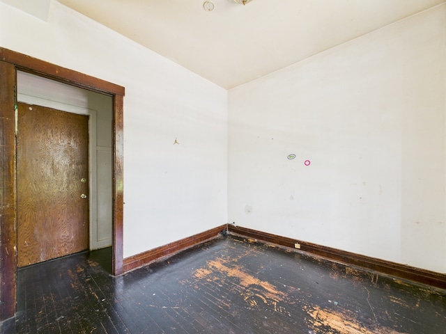 5045 W Erie St, Chicago, IL 60644 - spare room with baseboards and hardwood / wood-style floors