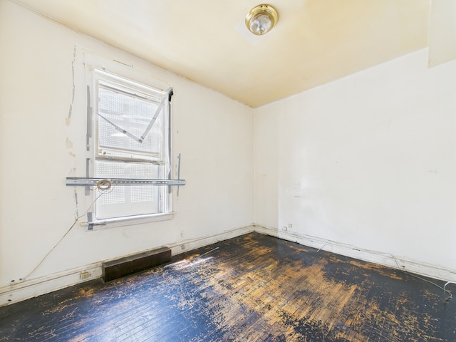 5045 W Erie St, Chicago, IL 60644 - spare room featuring hardwood / wood-style flooring