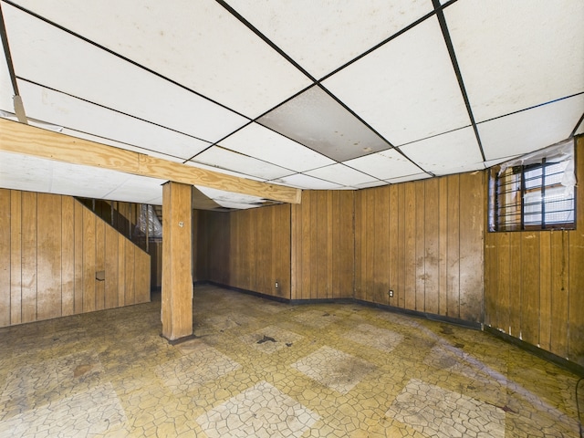 5045 W Erie St, Chicago, IL 60644 - basement with wood walls and a paneled ceiling