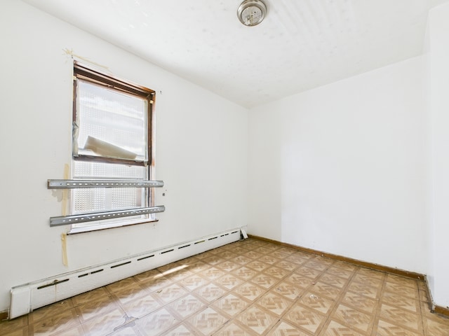 5045 W Erie St, Chicago, IL 60644 - empty room with baseboard heating and light floors