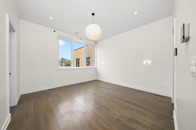 702 W Wellington Ave Unit 2N, Chicago, IL 60657 - empty room with dark wood-style floors and baseboards