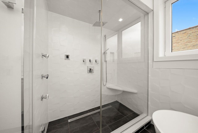 702 W Wellington Ave Unit 2N, Chicago, IL 60657 - bathroom with a shower stall, a soaking tub, and tile walls