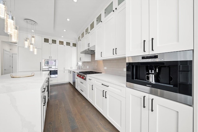 702 W Wellington Ave Unit 2N, Chicago, IL 60657 - kitchen featuring oven, cooktop, built in microwave, dark wood-type flooring, and recessed lighting