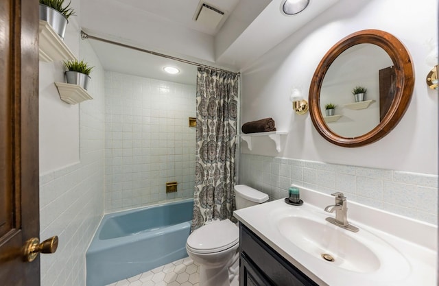 2527 Checker Rd, Long Grove, IL 60047 - bathroom featuring tile walls, vanity, shower / bathtub combination with curtain, wainscoting, and tile patterned floors