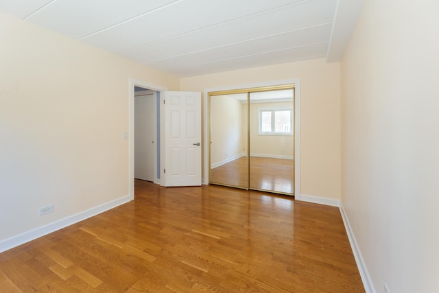 1633 River St Unit 2B, Des Plaines, IL 60016 - unfurnished bedroom featuring light wood finished floors and a closet