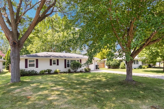 1807 21st Ave, Sterling, IL 61081 - ranch-style home featuring an attached garage, concrete driveway, and a front lawn