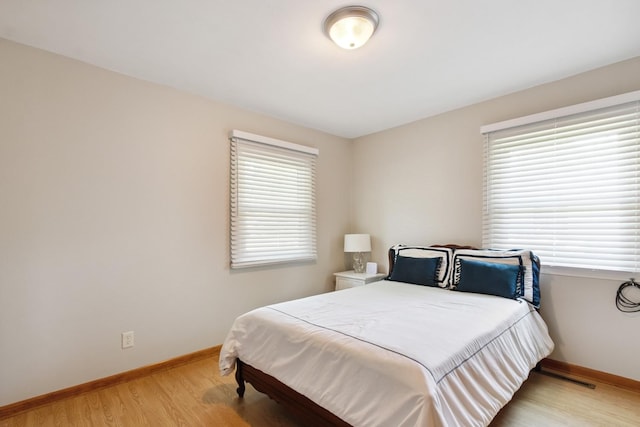 1807 21st Ave, Sterling, IL 61081 - bedroom with baseboards and light wood-style flooring