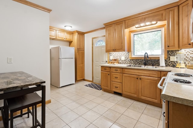 1807 21st Ave, Sterling, IL 61081 - kitchen featuring white appliances, backsplash, healthy amount of natural light, and crown molding