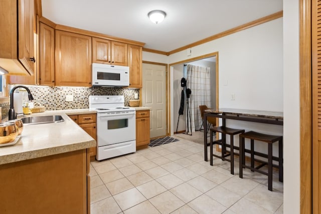 1807 21st Ave, Sterling, IL 61081 - kitchen with white appliances, light countertops, ornamental molding, decorative backsplash, and brown cabinets