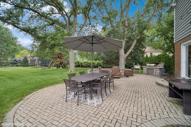 2113 Berwick St, Inverness, IL 60067 - view of patio with a playground, exterior kitchen, outdoor dining space, and outdoor lounge area