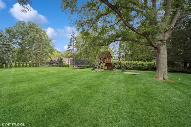 2113 Berwick St, Inverness, IL 60067 - view of green lawn featuring a trampoline and a playground