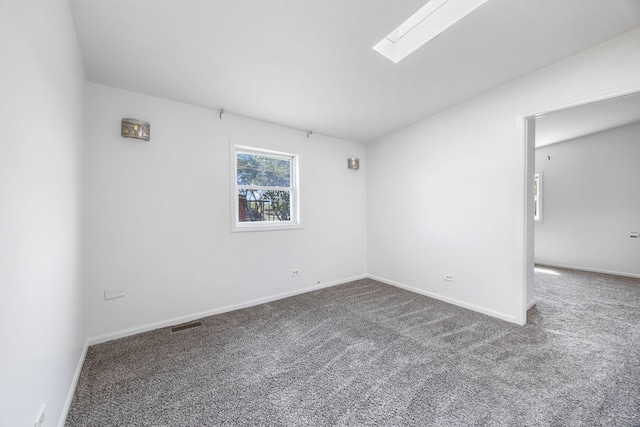 3722 S Wabash Ave, Chicago, IL 60653 - empty room featuring carpet and a skylight