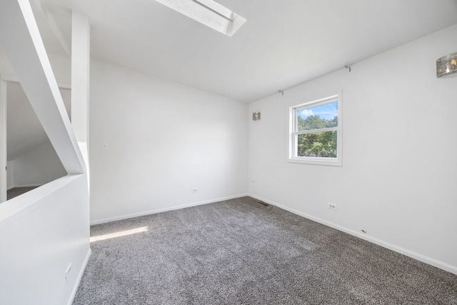 3722 S Wabash Ave, Chicago, IL 60653 - carpeted spare room featuring baseboards and a skylight