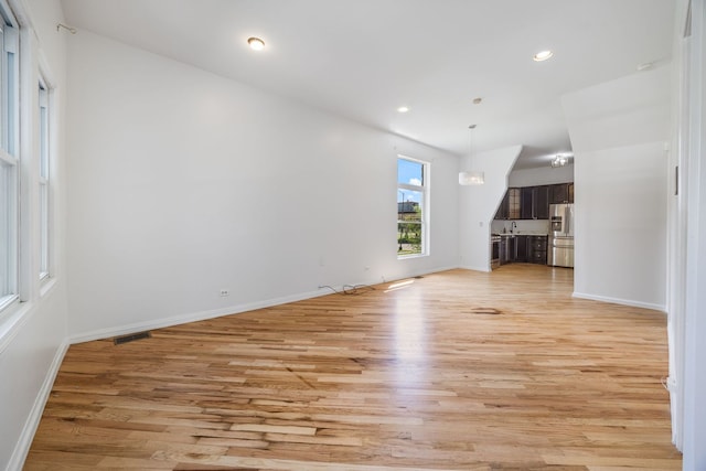 3722 S Wabash Ave, Chicago, IL 60653 - unfurnished living room featuring light wood-type flooring and recessed lighting