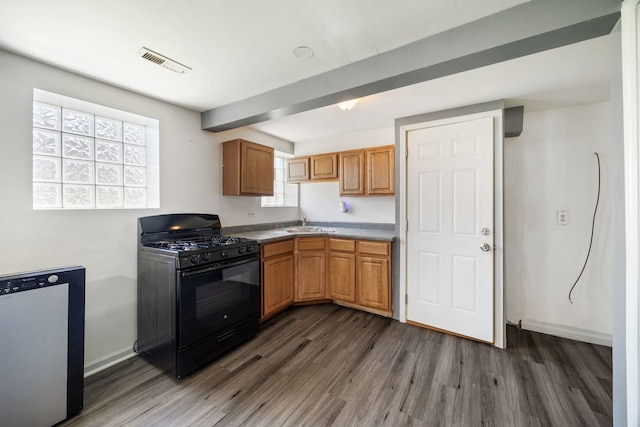 3722 S Wabash Ave, Chicago, IL 60653 - kitchen with black gas stove, dark wood-style floors, stainless steel dishwasher, and brown cabinets