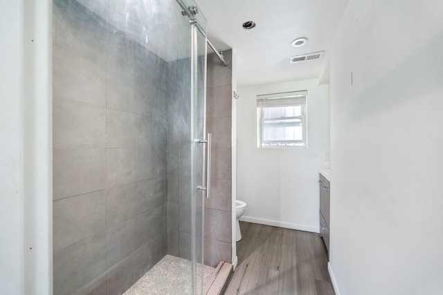 3722 S Wabash Ave, Chicago, IL 60653 - bathroom featuring wood finished floors, a stall shower, and vanity