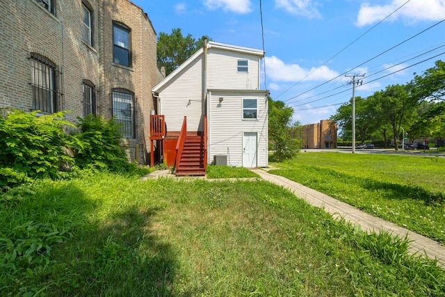 3722 S Wabash Ave, Chicago, IL 60653 - rear view of property featuring a yard and stairs