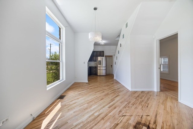 3722 S Wabash Ave, Chicago, IL 60653 - unfurnished living room featuring light wood-type flooring and baseboards