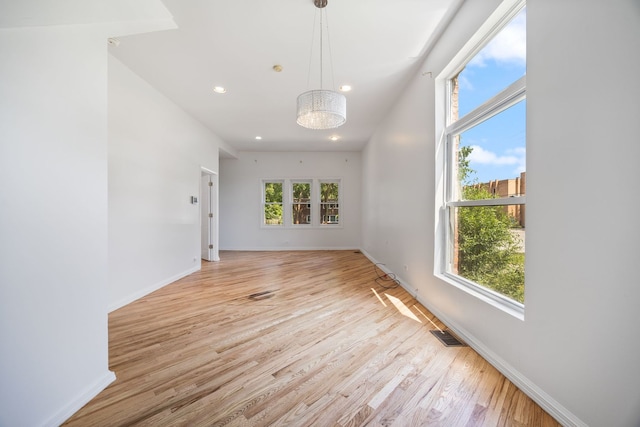 3722 S Wabash Ave, Chicago, IL 60653 - empty room with light wood-style floors, recessed lighting, and a chandelier