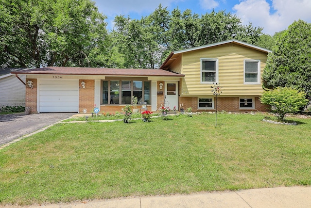 7936 N Ramsgate Cir, Hanover Park, IL 60133 - tri-level home featuring a garage, asphalt driveway, a front lawn, and brick siding