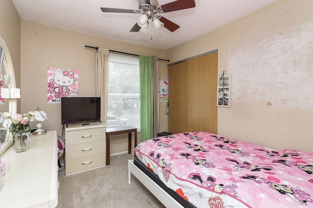 7936 N Ramsgate Cir, Hanover Park, IL 60133 - bedroom with light colored carpet, a closet, and a ceiling fan