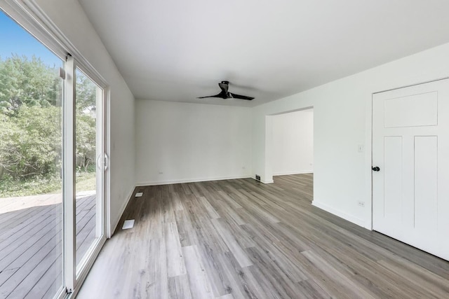 1329 Neskola Ct, Naperville, IL 60564 - unfurnished living room with light wood-style flooring and ceiling fan