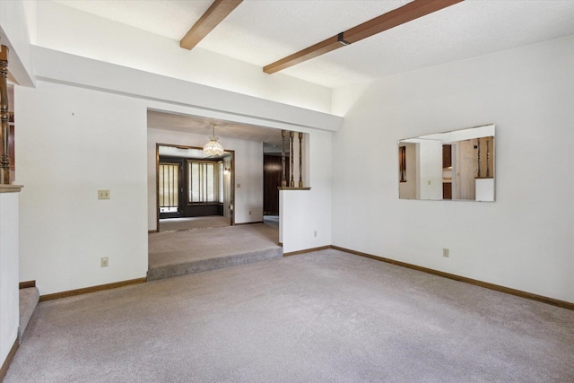 1619 Arnold Ave, Rockford, IL 61108 - unfurnished living room featuring carpet floors, beamed ceiling, and a chandelier