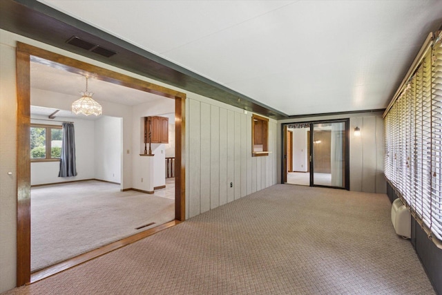 1619 Arnold Ave, Rockford, IL 61108 - unfurnished room with carpet and a chandelier