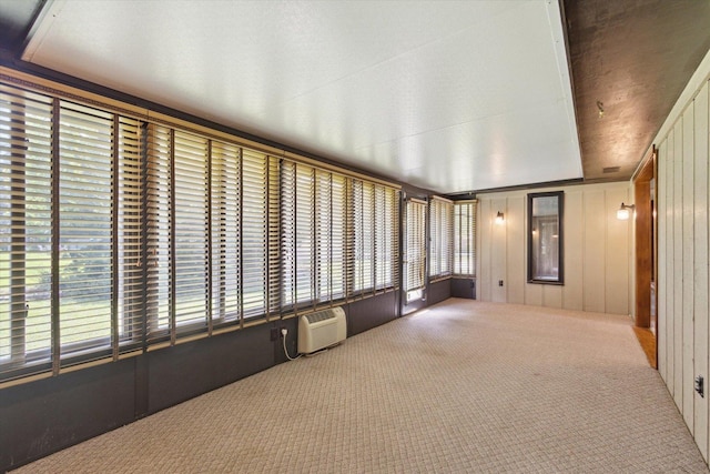 1619 Arnold Ave, Rockford, IL 61108 - unfurnished sunroom with healthy amount of natural light and a wall mounted AC