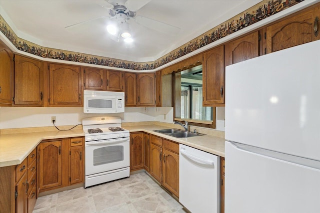 1619 Arnold Ave, Rockford, IL 61108 - kitchen featuring white appliances, brown cabinets, a ceiling fan, and light countertops
