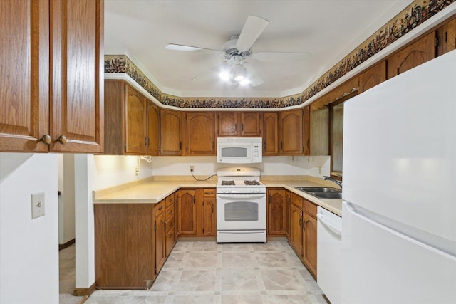1619 Arnold Ave, Rockford, IL 61108 - kitchen featuring white appliances, brown cabinets, ceiling fan, and light countertops