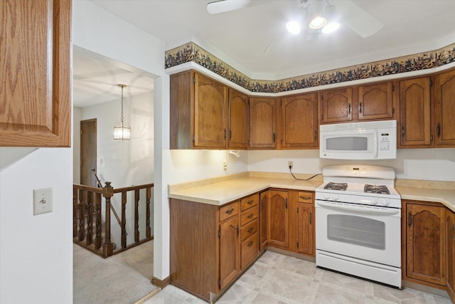 1619 Arnold Ave, Rockford, IL 61108 - kitchen with white appliances, ceiling fan, brown cabinetry, and light countertops
