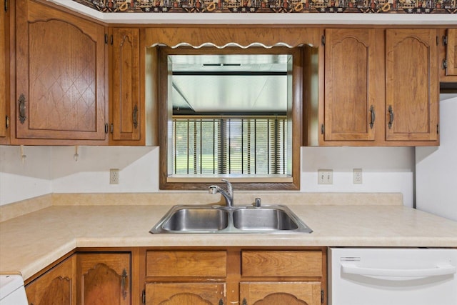 1619 Arnold Ave, Rockford, IL 61108 - kitchen with dishwasher, light countertops, and brown cabinetry