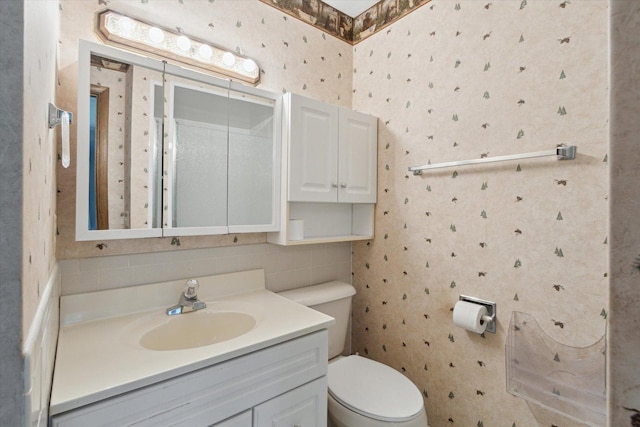1619 Arnold Ave, Rockford, IL 61108 - bathroom featuring wallpapered walls, vanity, and decorative backsplash