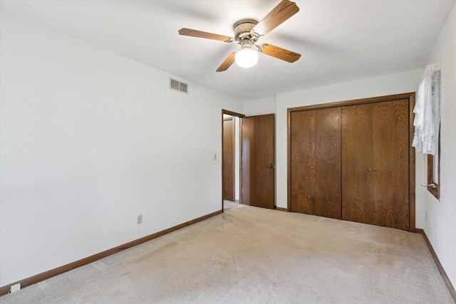 1619 Arnold Ave, Rockford, IL 61108 - unfurnished bedroom with light carpet, a closet, and ceiling fan