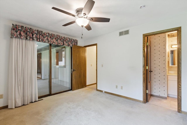 1619 Arnold Ave, Rockford, IL 61108 - unfurnished bedroom with carpet flooring, a ceiling fan, and ensuite bathroom