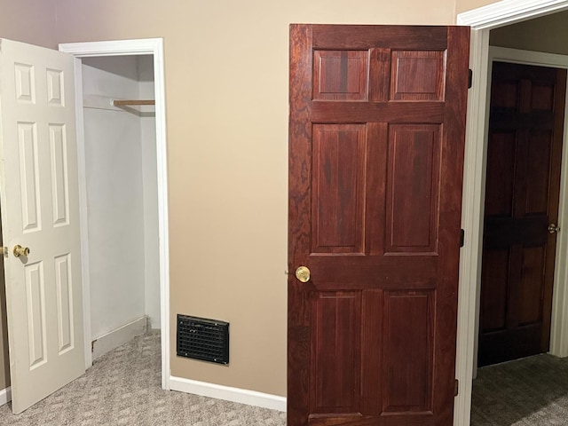 541 W Grove St, Bloomington, IL 61701 - unfurnished bedroom featuring light carpet and baseboards