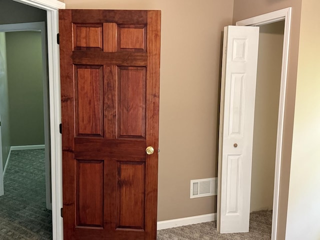 541 W Grove St, Bloomington, IL 61701 - unfurnished bedroom featuring carpet and baseboards