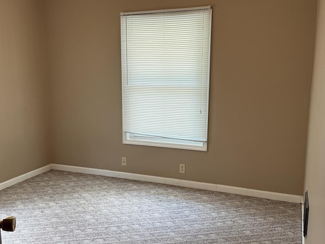 541 W Grove St, Bloomington, IL 61701 - spare room with carpet floors and baseboards
