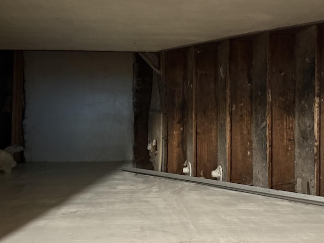 541 W Grove St, Bloomington, IL 61701 - unfurnished room featuring wooden walls