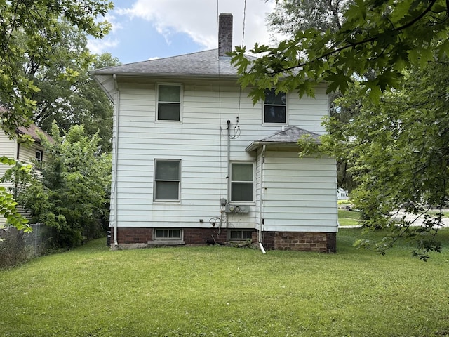 541 W Grove St, Bloomington, IL 61701 - back of property with a yard and a chimney