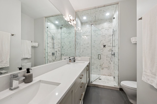 2422 W Lyndale St Unit 1E, Chicago, IL 60647 - bathroom with double vanity, a shower stall, tile patterned flooring, and recessed lighting