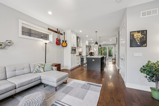 2422 W Lyndale St Unit 1E, Chicago, IL 60647 - living room with dark wood-style flooring and recessed lighting