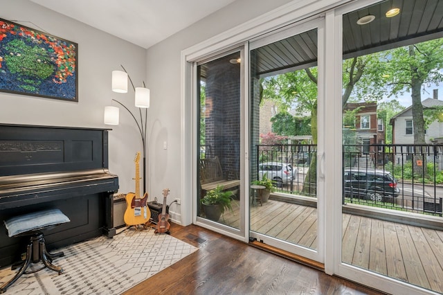2422 W Lyndale St Unit 1E, Chicago, IL 60647 - doorway to outside featuring wood finished floors and baseboards