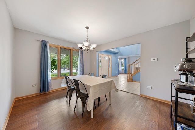 19600 Brookridge Dr, Tinley Park, IL 60487 - dining room with a chandelier, healthy amount of natural light, stairs, and light wood-style floors
