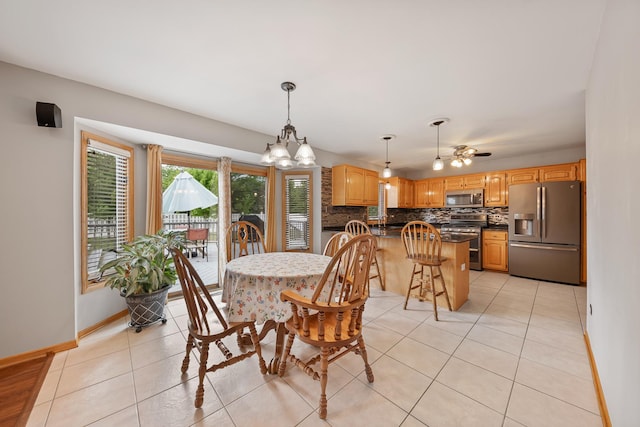 19600 Brookridge Dr, Tinley Park, IL 60487 - dining space featuring light tile patterned floors, a chandelier, and a ceiling fan