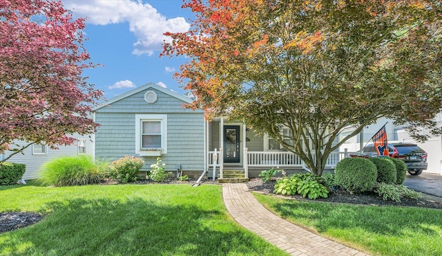 411 Hessel Blvd, Champaign, IL 61820 - view of front facade featuring covered porch and a front lawn