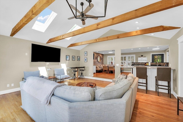 411 Hessel Blvd, Champaign, IL 61820 - living room with beamed ceiling, a ceiling fan, light wood-type flooring, recessed lighting, and a skylight